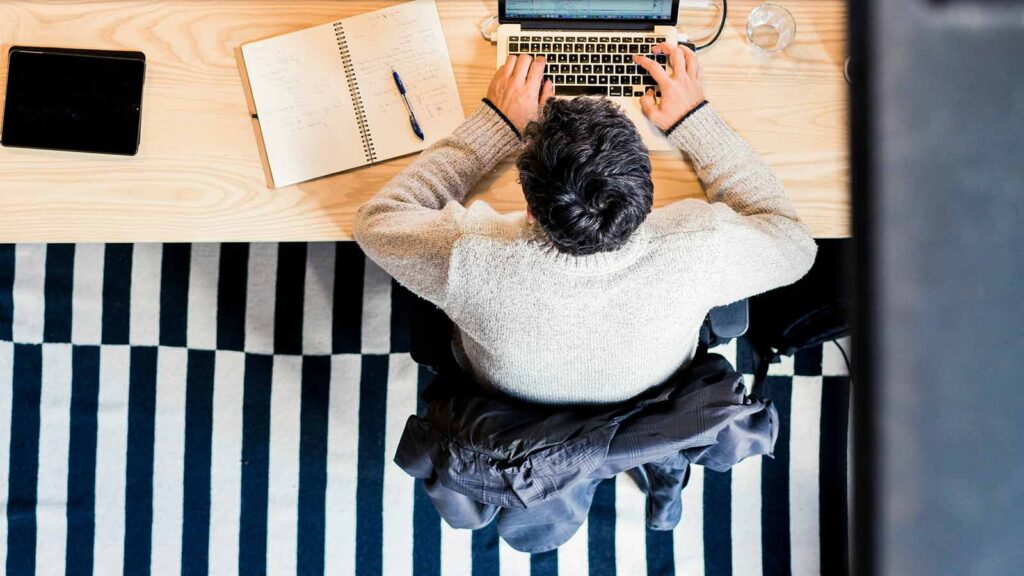 Guy working on his computer AFX Research Integrates with ICE Mortgage Technology’s Encompass Platform to Deliver Same-Day Title Updates