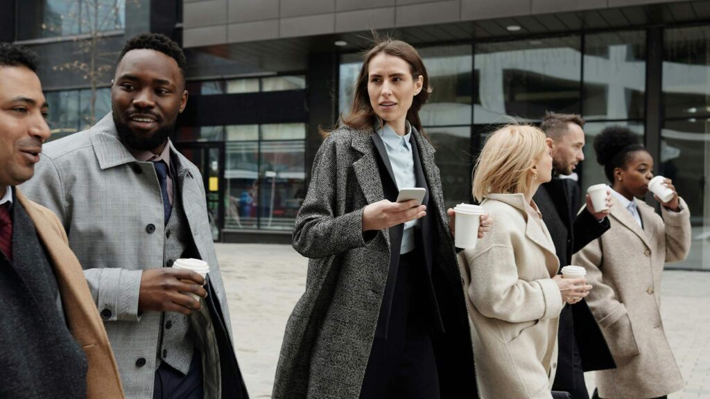 a group of people walking outside a building Lending Industry mortgage ucc search artificial intelligence in real estate local title company title update