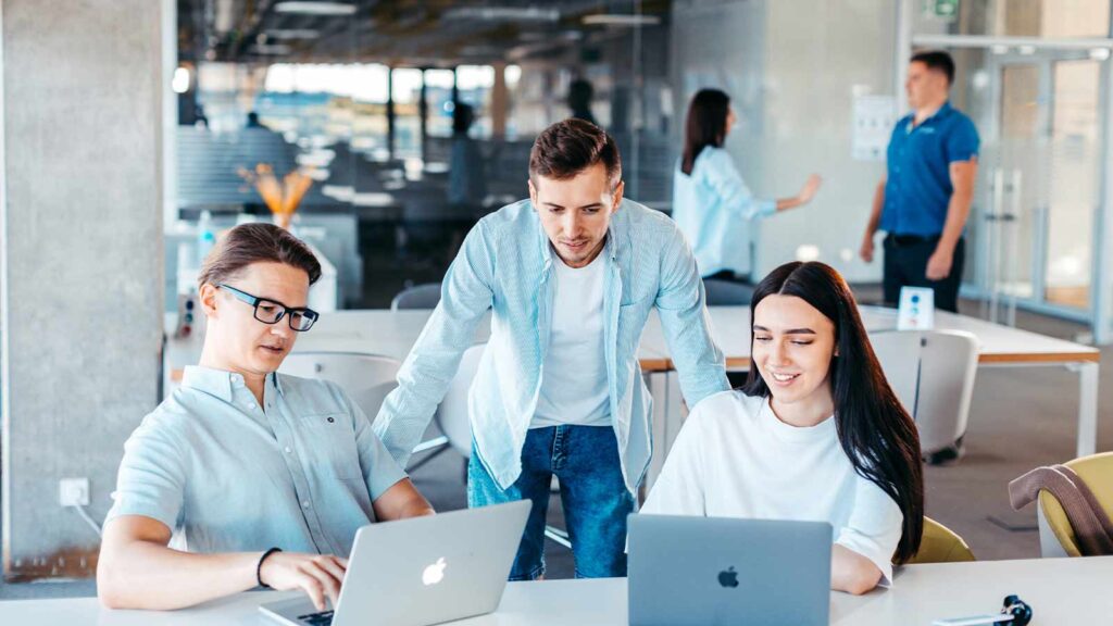 a group of people looking at laptops mortgage lien lien release chain of title title search company title abstractor title search services mineral rights search title update