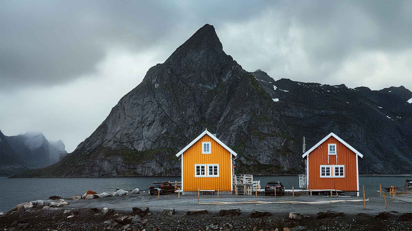 Colorful cabins by a dramatic mountain that has Parcel Data