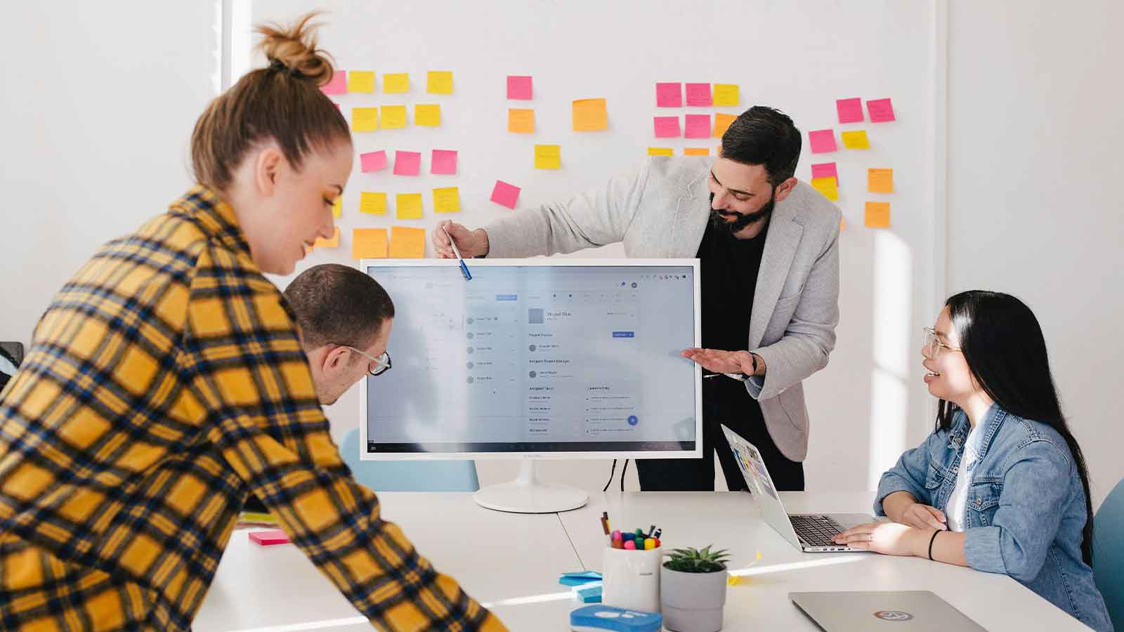 Team collaborating in a modern workspace. title search