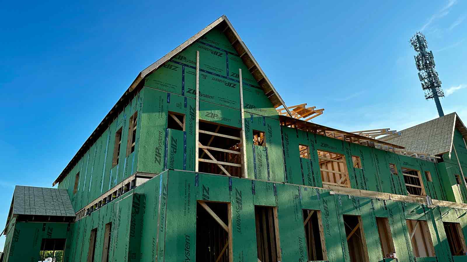 New building under construction, green sheathing Construction Lending