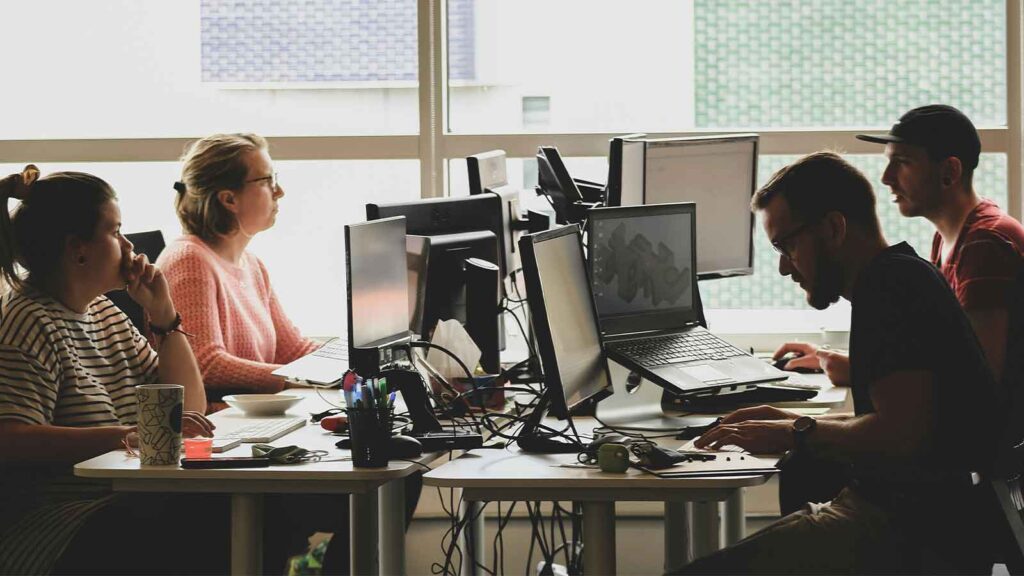 ppl at work talking Geospatial Intelligence