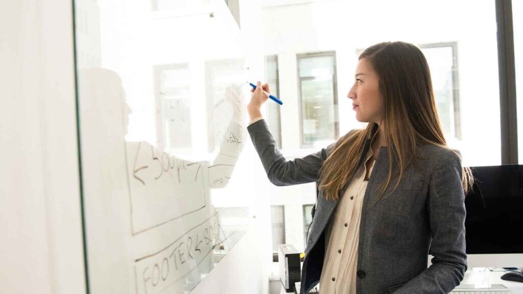 JSON Title Data women writing on a whiteboard