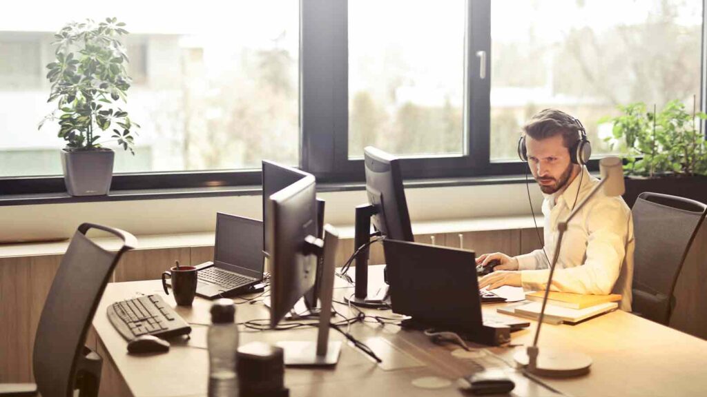 Mortgage Lenders guy review stuff on his computer