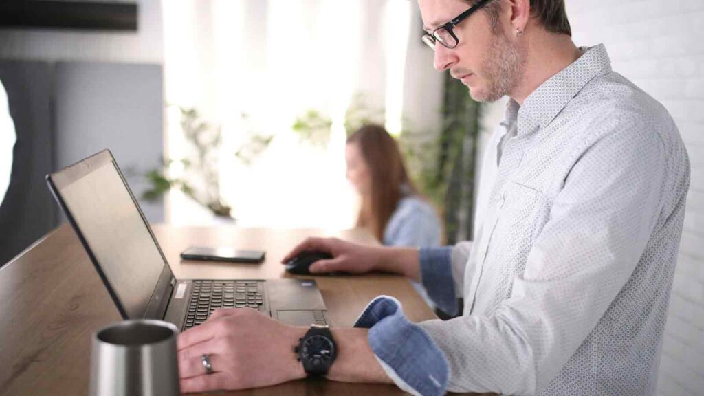 guy looking at Mortgage Records Search on his computer